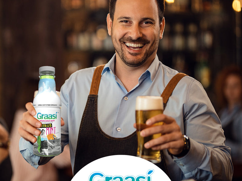 bartender serving beer and graasi